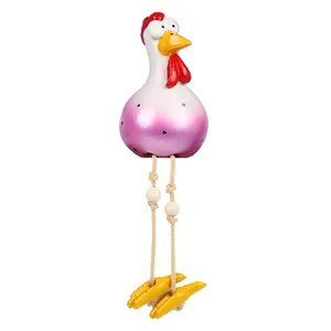 Detailed macro of a resin long-legged chicken ornament with purple gradient and green dots
