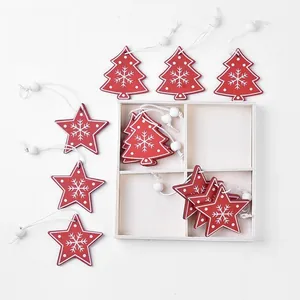 Wooden Christmas pendants set in red and white with snowflake patterns and storage box