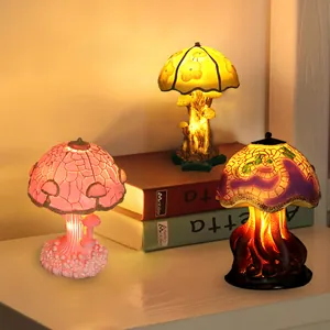 Three decorative mushroom lamps in colorful artistic styles with warm ambient lighting