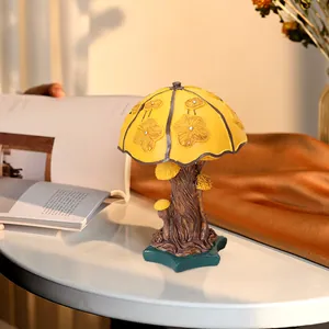 Colorful mushroom table lamp ornament with yellow floral top and rustic tree base