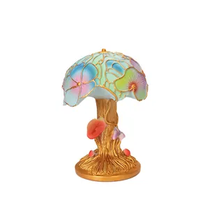 Colorful Tiffany-style mushroom table lamp with floral stained glass and golden resin base