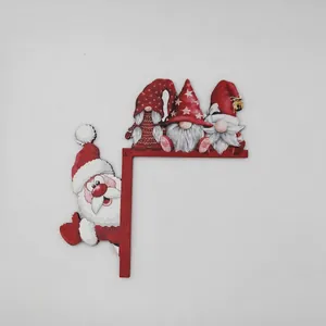 Detail of wooden L-shaped Christmas Santa Claus door frame decoration measuring 18x18.5 cm