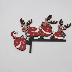 Detailed view of wooden Santa and reindeer door frame decor with 18x23.5cm dimensions