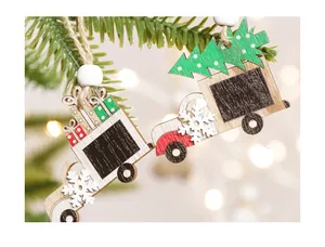 Detail of wooden Christmas truck pendants with pine branches and festive bokeh background