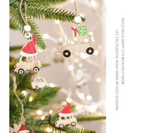 Detail of wooden Christmas car pendants with twine ropes on a blurry tree background