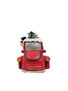 Detail of red vintage truck Christmas resin decor with mini tree and snowman figure
