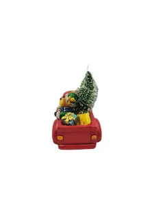 Resin Christmas ornament featuring a red truck carrying a mini tree, bear, and gift boxes