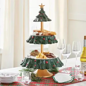 Three-tier Christmas tree snack bowl rack with green trays and golden star topper