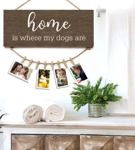 Detail of wooden home photo hanging board with hemp rope and clips for dog lovers