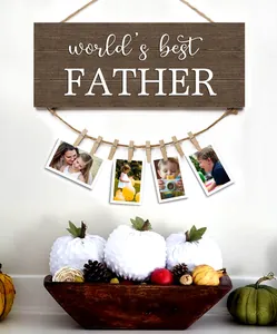 Detail of wooden picture display board with world's best FATHER print and clips