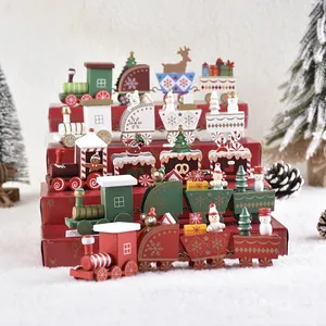 Handcrafted wooden Christmas train sets with snowmen and reindeer on a winter background