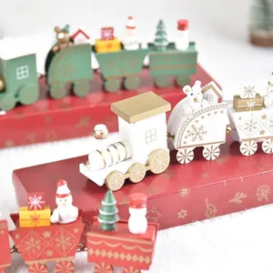 Nordic wooden Christmas train set with festive miniature figures in white green red colors