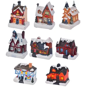 Set of 8 glowing Christmas resin house miniatures with snow details and hand-painted finish