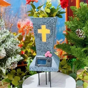 Solar memorial vase with glowing cross and red roses for garden cemetery decoration