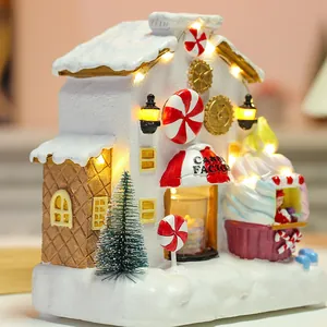 Luminous resin Christmas candy factory house with LED lights and miniature Xmas tree decor