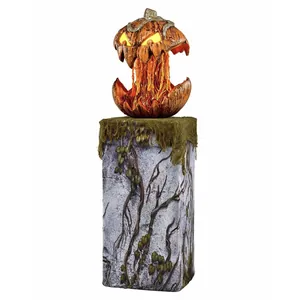 Glow-in-the-dark Halloween pumpkin head with scary LED eyes on vintage stone base