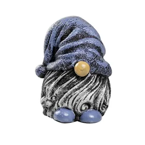 Garden gnome statue made of resin with a blue pointed hat and white wavy beard decor