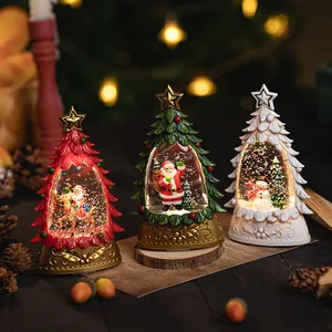 Festive Christmas snow globes with Santa, reindeer and snowman in warm bokeh light