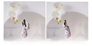 Detailed view of resin wedding couple figurine with hand-painted wood-like texture