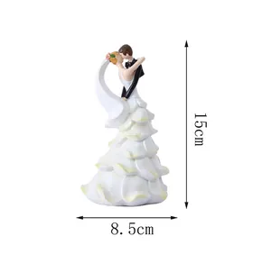 Wedding cake topper figurine of a romantic couple with 15cm height dimensions