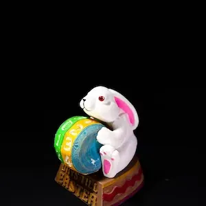 Macro shot of resin Easter bunny figurine with countdown dial showing Days Till Easter