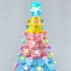 Macro view of light-up Easter gnome tree featuring colorful LED beads and egg topper