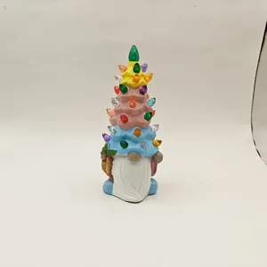 Detail of light-up gnome figurine with colorful bulbs on a tiered Christmas tree hat