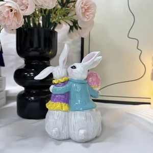 Osterhasen-Paar aus Harz mit bunten Eiern, dekorative Figuren für das gemütliche Heim