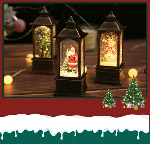 Close-up of vintage Christmas water lanterns with Santa, snowman and warm glowing light