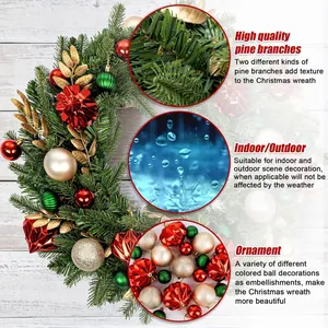 Green Christmas wreath with red and gold ornaments on white wooden background