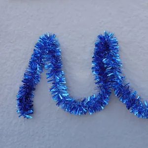 Deep blue metallic Christmas tinsel garland for festive party decoration and wall hanging
