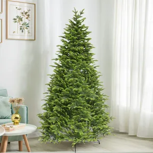 Close-up of dense green PE artificial Christmas tree with realistic pine needles
