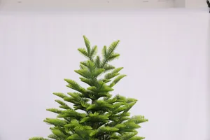 Detailed close-up showing the realistic PE needle texture of the green pine Christmas tree