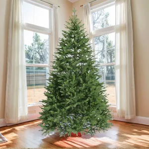 Detailed view of lush PE Christmas tree branches with natural green needles and sturdy base