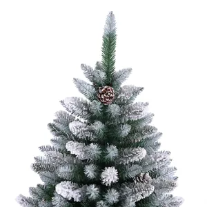 Deep green flocked PE Christmas tree with realistic snow and natural pine cones decoration