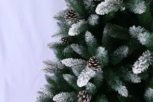 Close-up detail of frosted PE pine needles and natural brown pine cones on Christmas tree