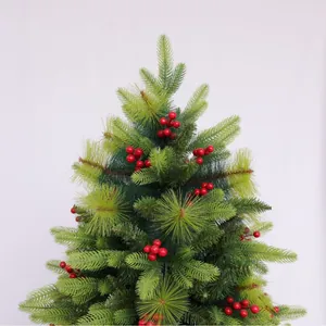 Artificial pine Christmas tree branch with red berries on white background