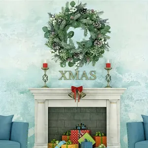 Christmas wreath with eucalyptus leaves, pine needles, pine cones and white berries