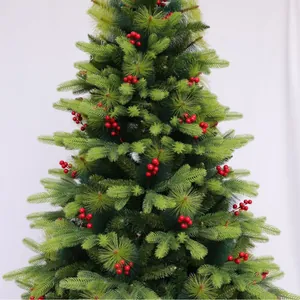 Artificial Christmas tree with green pine needles and red berries on white background