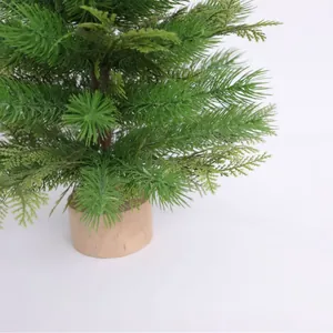 Miniature artificial Christmas tree with realistic PE pine needles and natural wood base