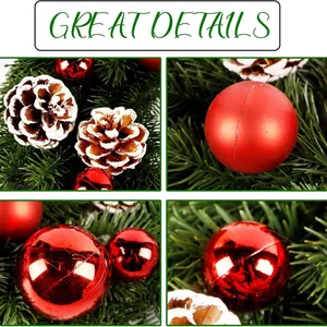 Christmas wreath with festive red baubles, pine cones and frosted needles