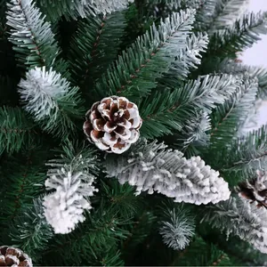 Green PE flocked Christmas tree branch with snowy pine cones for festive decoration