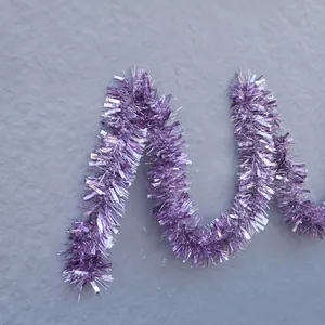 Light purple shimmering metallic tinsel garland for festive party and Christmas decoration