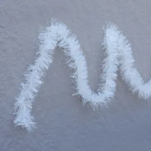 White Christmas tinsel garland with wavy metallic fibers for festive holiday decoration