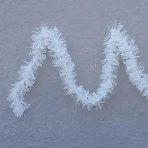 Pluffy pure white Christmas tinsel garland for festive holiday party tree decoration
