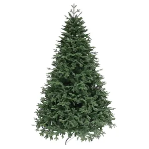 Lush dark green artificial Christmas tree with metal stand on white background
