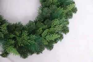 Close-up of realistic pine needles and arborvitae leaves on a Christmas wreath