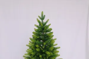 Close-up of realistic PE and PVC light green Christmas tree needles with dense branch texture