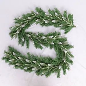 Frosted pine needle Christmas garland with white snow finish for festive indoor decor