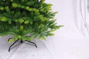 Detail of light green PE PVC Christmas tree with sturdy black metal cross stand